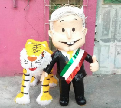 Crean piñata de AMLO acompañada de 'un tigre'